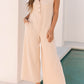 Smoke Gray Textured Buttoned Wide Leg Sleeveless Jumpsuit