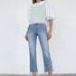 JEANS CROPPED DE TIRO ALTO CON CORTE DE BOTA